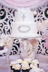 white cake with a cross for the Baptists