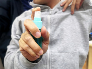 Hand of man is spraying alcohol.Germs, Coronavirus disinfectants, Covid19 disinfectants, alcohol Spray, Spraying alcohol, Spraying coronavirus, Spraying covid 19, cleaning coronavirus and covid 19.