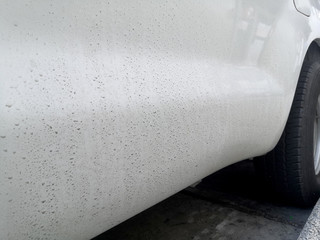 Dirty white car with water stained dry.Wash Car care Concept.