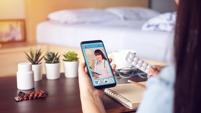 sick woman use video conference, make online consultation with doctor on mobile application, patient ask doctor about illness, medication via video call. Telehealth, Telemedicine and online hospital