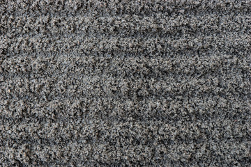 Dark gray fine gravel stones as background or texture