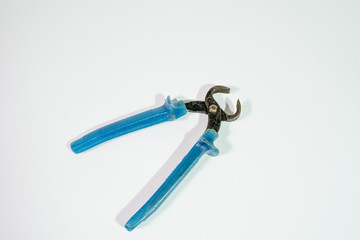 Old pliers on a white background. An essential tool for the home. Isolate