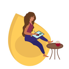A girl draws an illustration on a tablet.