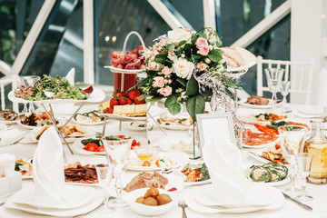 Wedding table in a room and flowers on a table
