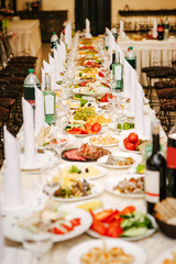 Long table with food without people.
