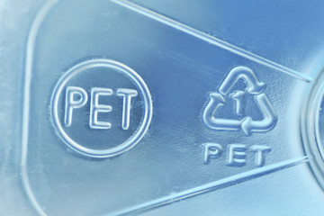 Close-up of plastic recycling symbol 01 PET (Polyethylene terephthalate) - 335210844