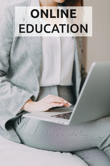 Online education on the Internet. Hands at work on a laptop with bokeh. Work from home during quarantine.