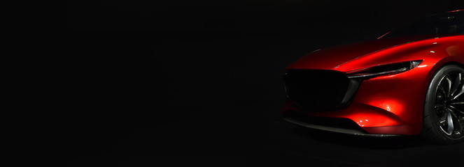 Red modern car headlights on black background,copy space