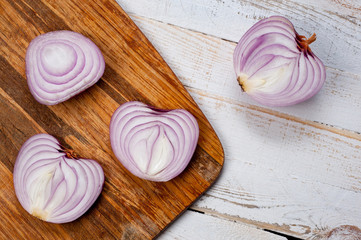 Red onion, lettuce. Health benefits, very rich in vitamins. Background for vegetables and garden plants and cooking.