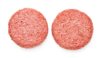two pieces of ground meat substitutes for vegetarian burgers isolated on white background