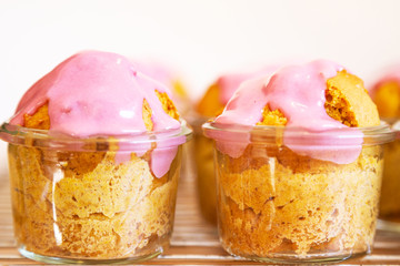 Vegan cupcakes in a jar with raspberry cream cheese frosting