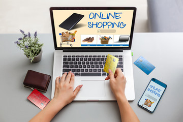 Businessman Using Laptop With Online Shopping Application On A Screen