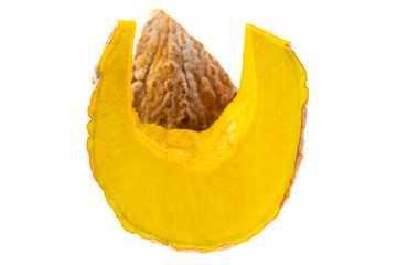 Slice of ripe yellow pumpkin on a white background.	