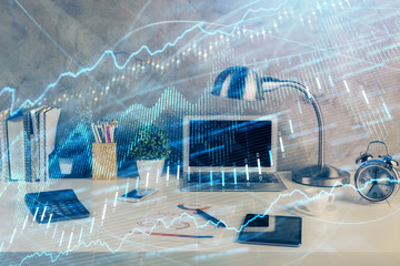 Double exposure of forex graph and work space with computer. Concept of international online trading.