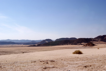 Beautiful panorama of the Sinai Desert. Mountains and sands of different shades. Clear blue sky