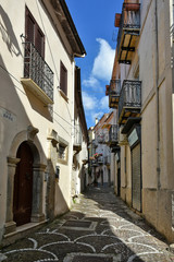 Obraz premium Pizzone, Italy, 07/12/2018. A narrow street between the houses of a village in the Molise region