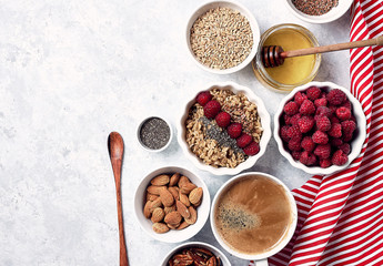 healthy oatmeal breakfast with raspberries and finns, chia and flax seeds and honey, pattern, top visas, good morning concept