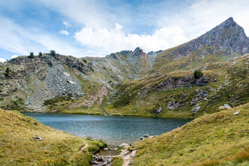 green mountain lake.  Lago di Loie in summer, Lillaz, Cogne, Aosta valley, Italy