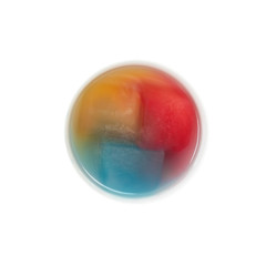 Top view of bowl with ice melting in colors