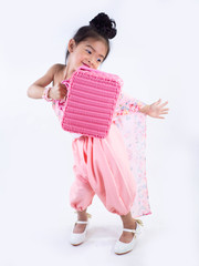 children girl in pink traditional Thai dress with bag for Welcome Songkran Festival on white background
