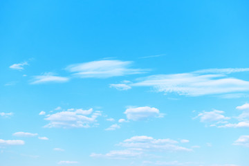Light blue sky with clouds -  natural background