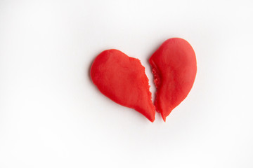 Fototapeta premium red heart split in two, quarrel concept. copyspace for text.
