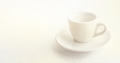 white coffee cup and saucer, empty coffee-free coffee cup, front view from above, or black coffee, on a white background,copy space