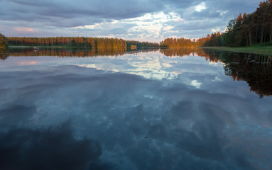 sunset in summer by the lake in Finland