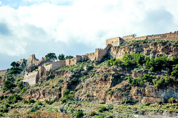 Fototapeta na wymiar old mountain fortress in spain, background with historical building