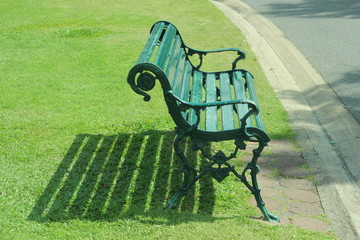 
Chair for relaxing in the park - obrazy, fototapety, plakaty