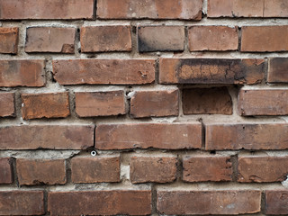 wall of old damaged red brick