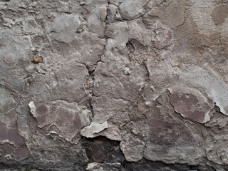 old, cracked damaged plastered wall