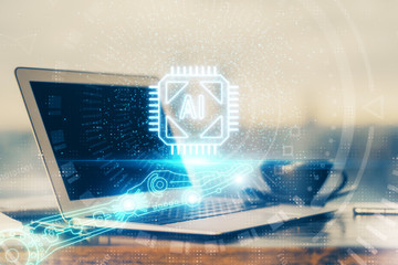 Double exposure of desktop computer and technology theme hologram. Concept of software development.
