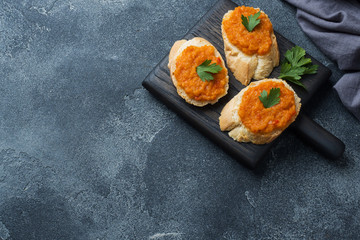 Sandwiches with bread zucchini caviar tomatoes onions. Homemade vegetarian food. Copy space.