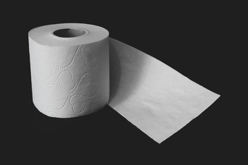 Toilet paper roll on black background