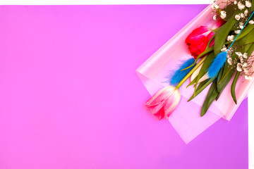 delicate bouquet with tulips on a pink background