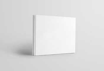 Mockup blank landscape orientation of a book standing and isolated on a white background, front...