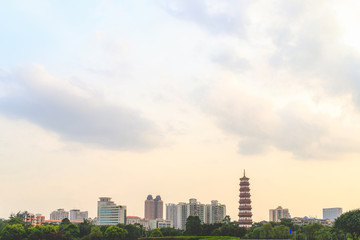 A panoramic view of the tall buildings, tourist attractions and the sky in Guangzhou, China in the evening