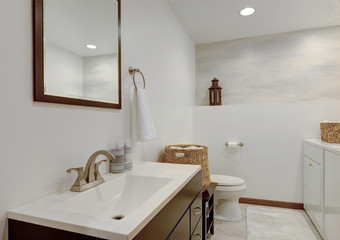 Simple white new cute bathroom interior with natural rustic touches.