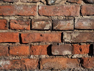 wall of old damaged red brick