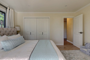 Aqua and ivory soft girls bedroom with white and linen.