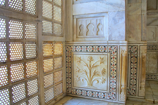 AGRA, INDIA - NOVEMBER 9: Lattice jali screen and decorated wall inside Taj Mahal on November 9, 2014 in Agra, India. It was built in 1632 by the Mughal emperor Shah Jahan to house the tomb of his fav