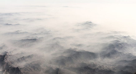 Aerial landscape mountain lost in thick fog in China, bird eye view landscape look like a soft...