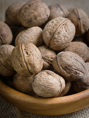 Closeup of nuts in a wooden plate