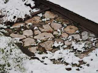 pavement of stones covered with snow