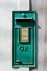 Green postbox with 