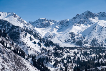 Fototapeta na wymiar Winter mountains covered with snow landscape. Tien shan mountains in winter.