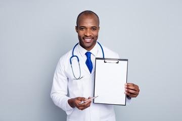 Photo of professional family doctor dark skin guy hold pen clipboard prescription insurance...