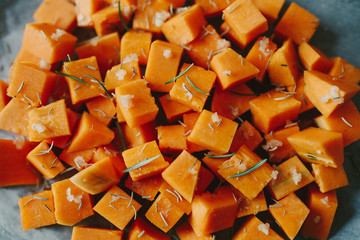 Baked in oven pumpkin with a salt, garlic and rosemary. Side dish ready to eat. Autumn recipes. Vegan food.
