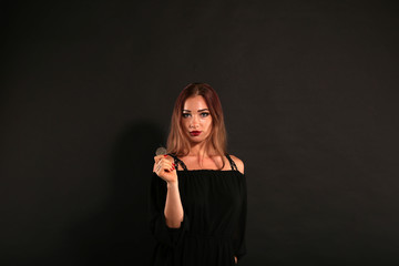 Obraz premium Beautiful woman holding and throwing the silver coin